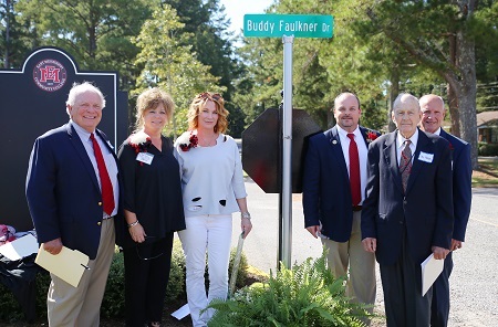 During East Mississippi Community College’s Homecoming activities, a road on the college’s Scooba campus was renamed and dedicated in memory of the late Buddy Faulkner, a long-time supporter of the college. Pictured at the dedication are, from left, former EMCC Vice President of Institutional Advancement Nick Clark, EMCC Director of Alumni Affairs and Foundation Operations Gina Cotton, Tina Faulkner, the wife of Buddy Faulkner, EMCC Executive Director of College Advancement Marcus Wood, EMCC Development Foundation Board member Ike Hopper, and EMCC Interim President Dr. Randall Bradberry. During East Mississippi Community College’s Homecoming activities, a road on the college’s Scooba campus was renamed and dedicated in memory of the late Buddy Faulkner, a long-time supporter of the college. Pictured at the dedication are, from left, former EMCC Vice President of Institutional Advancement Nick Clark, EMCC Director of Alumni Affairs and Foundation Operations Gina Cotton, Tina Faulkner, the wife of Buddy Faulkner, EMCC Executive Director of College Advancement Marcus Wood, EMCC Development Foundation Board member Ike Hopper, and EMCC Interim President Dr. Randall Bradberry.
