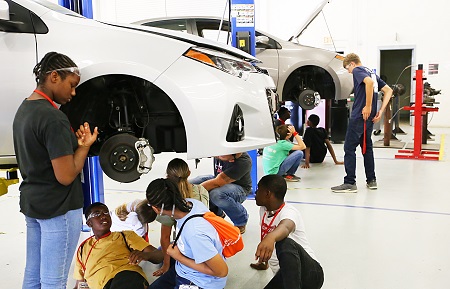 Students enrolled in Camp AMP on East Mississippi Community College’s Golden Triangle campus learn to remove and install brake pads. Camp AMP exposes students to manufacturing at an early age. Students enrolled in Camp AMP on East Mississippi Community College’s Golden Triangle campus learn to remove and install brake pads. Camp AMP exposes students to manufacturing at an early age.